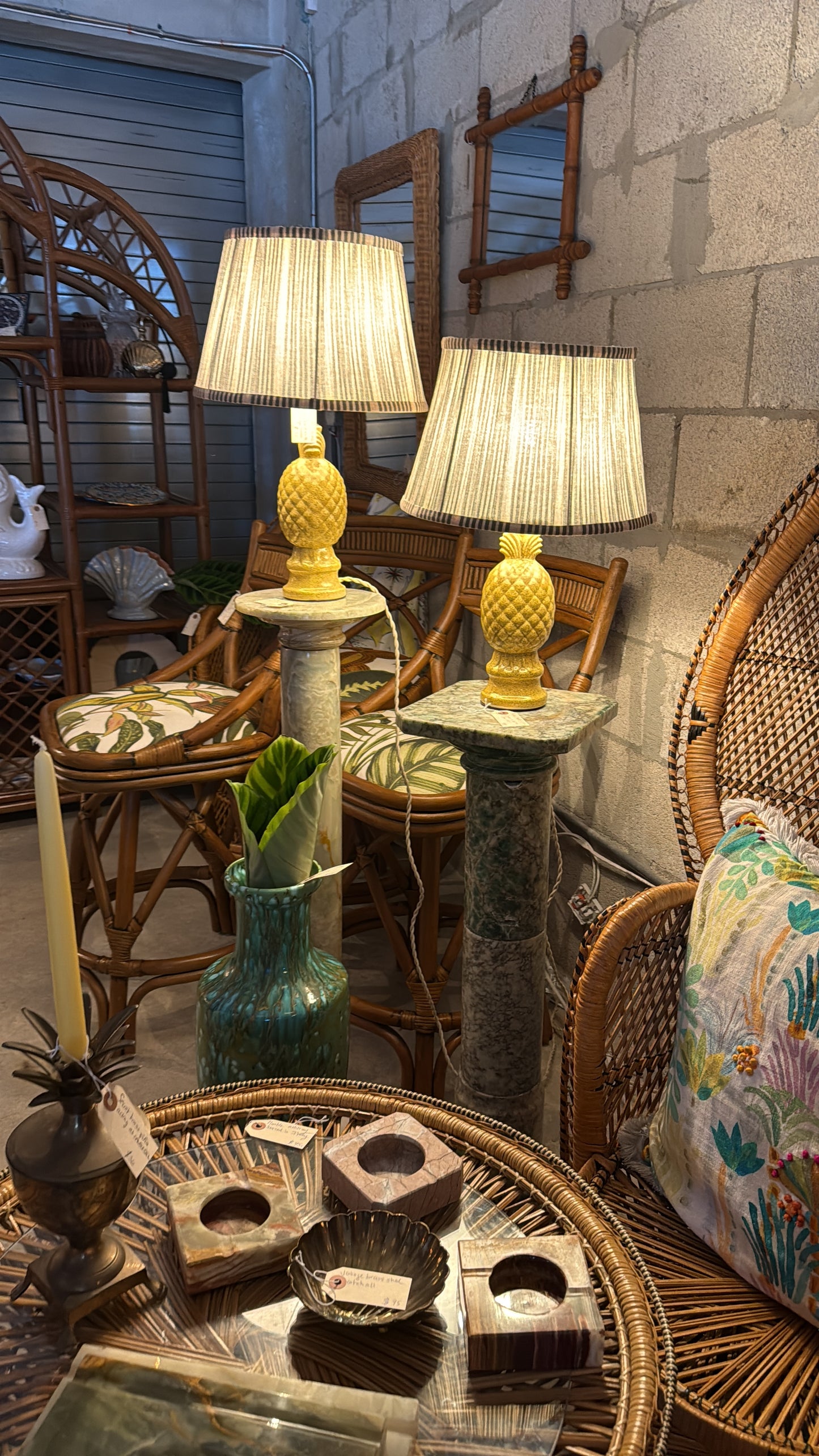Pair of illuminated vintage pineapple lamps styled with collected furniture and décor