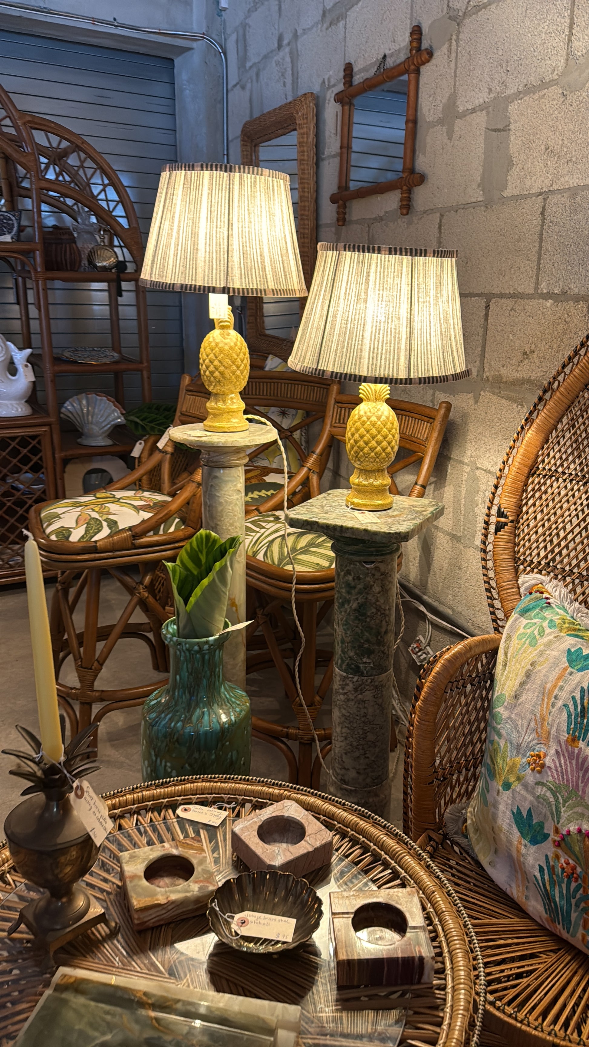 Pair of illuminated vintage pineapple lamps styled with collected furniture and décor