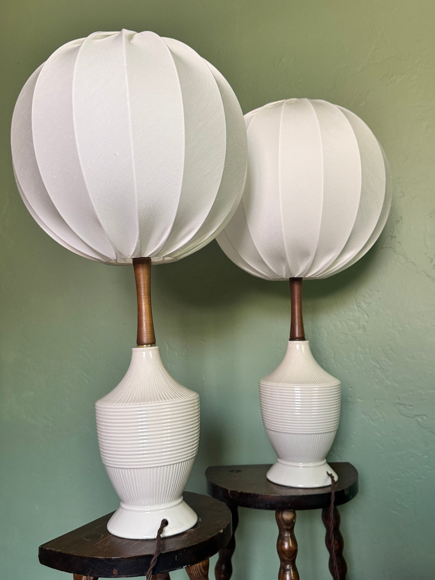 closer view of the lamps pair showing off silky shades