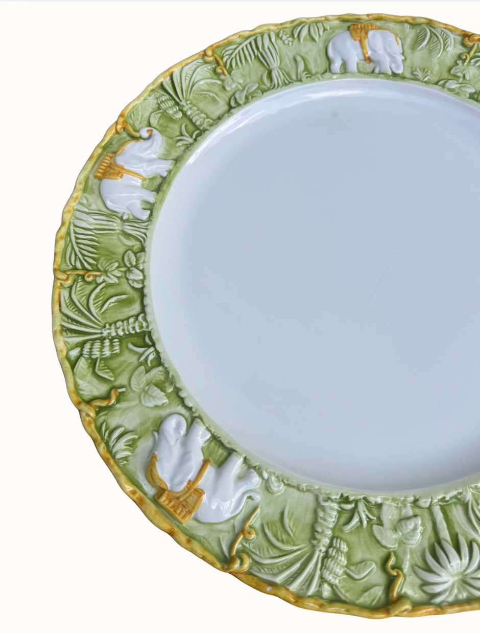 Sage-green majolica charger with sculpted elephants and tropical foliage