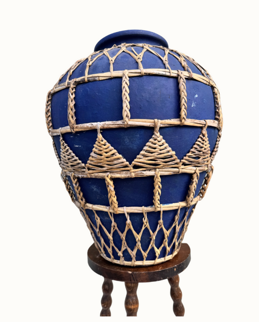 Cobalt blue glaze beneath woven rattan lattice