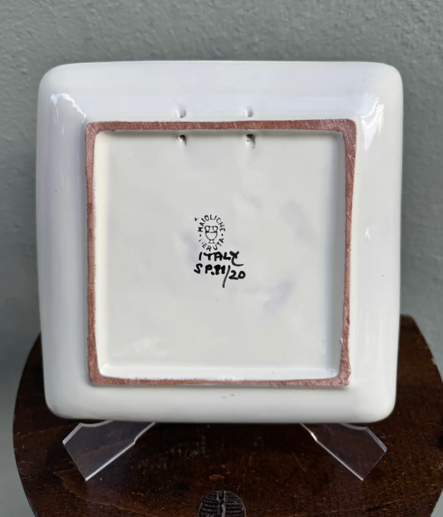 Vintage mid–late 20th century Italian maiolica square dish with hand-worked sgraffito decoration and Renaissance-inspired acanthus and floral motifs. Approximately 6" square and marked “Maiolica, Italy, S.P.M./20.”