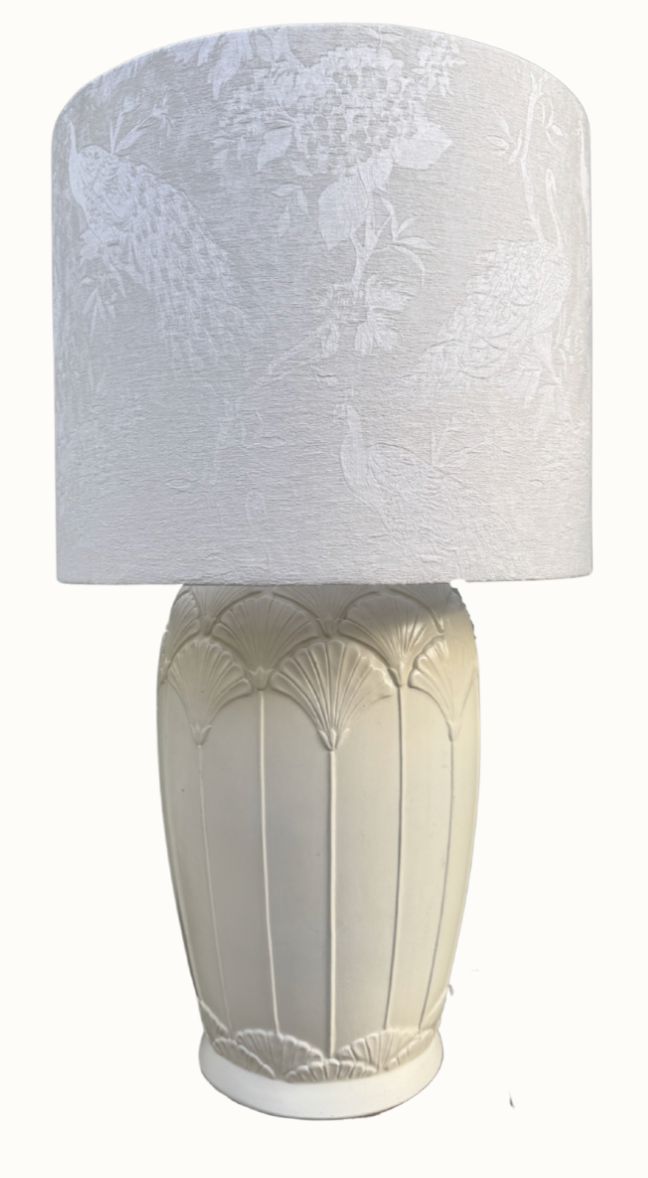 Vintage white Art Deco ceramic lamp illuminated