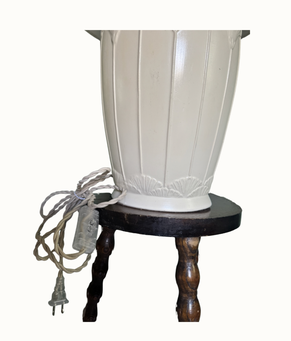 Restored Art Deco Revival lamp styled in an interior close up of new wiring