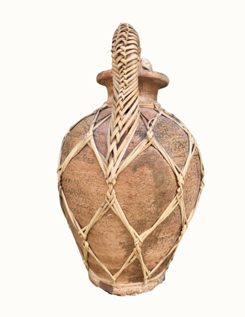 Natural rattan weave on vintage Mediterranean floor vessel
