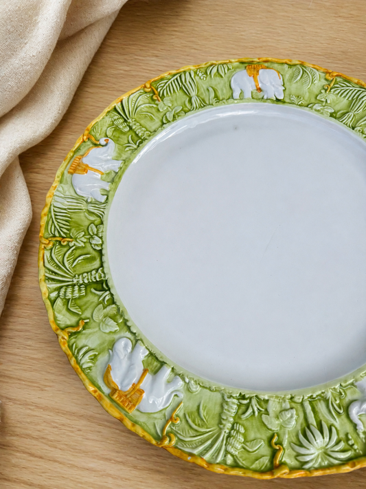 Vintage Italian elephant charger styled on pale wood and ivory linen